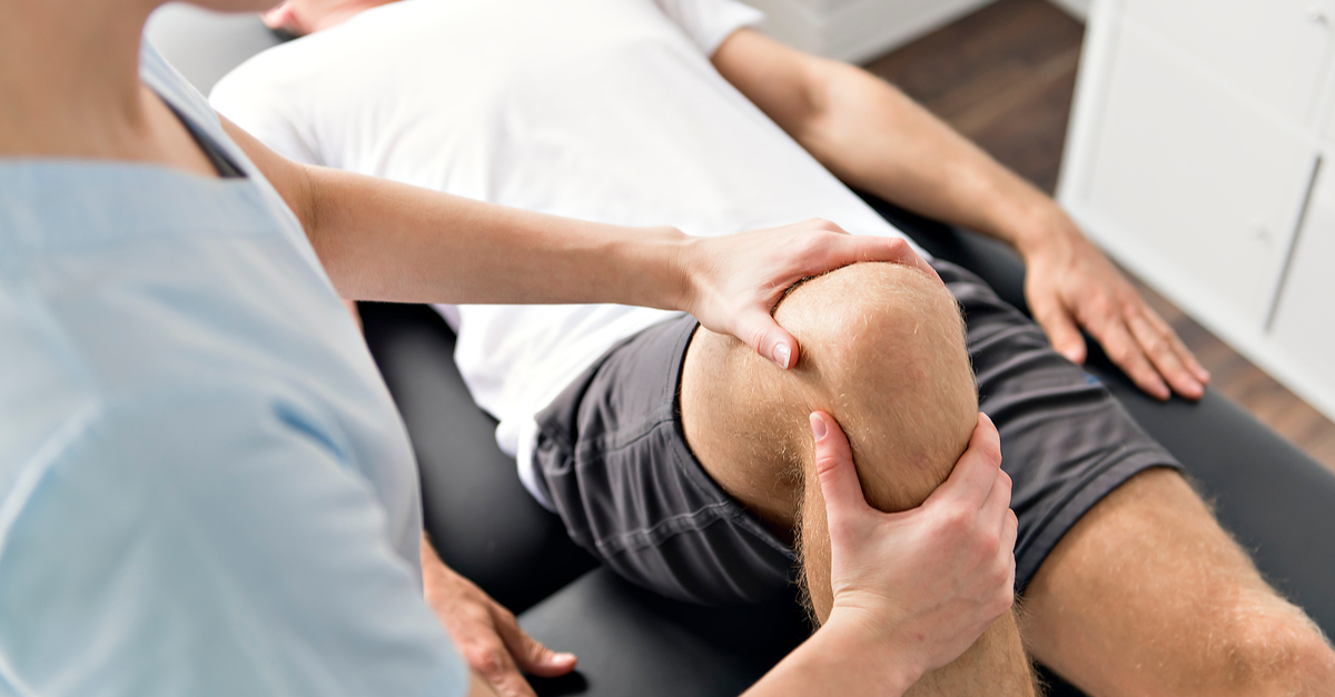 Knee massage during a physical therapy session